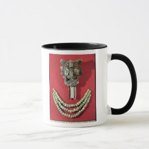 Zapotec pectoral the form of  mask representing mug