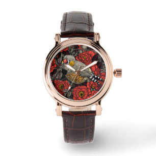 Zebra finch and red rose bush watch