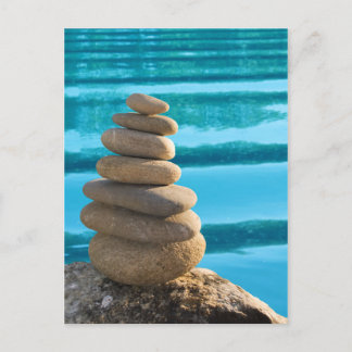 Zen stone tower with blue water postcard