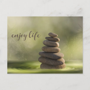 Zen stones tower in water tranquility and calm postcard