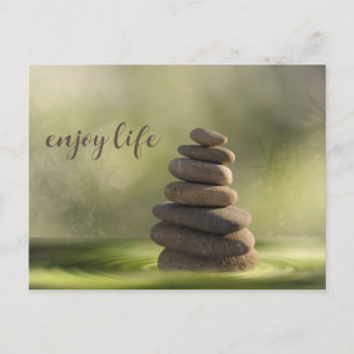 Zen stones tower in water tranquility and calm postcard